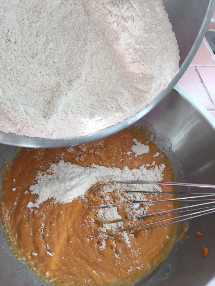 Slowly adding dry ingredients to wet mixture Pumpkin Cream Cheese Bread Recipe Baking Those Someday Goals
