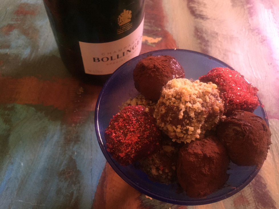 Cointreau chocolate truffles in blue dish by bottle of Bollinger Champagne Easy Chocolate Truffles Recipe Those Someday Goals Valentine's Day dessert ideas