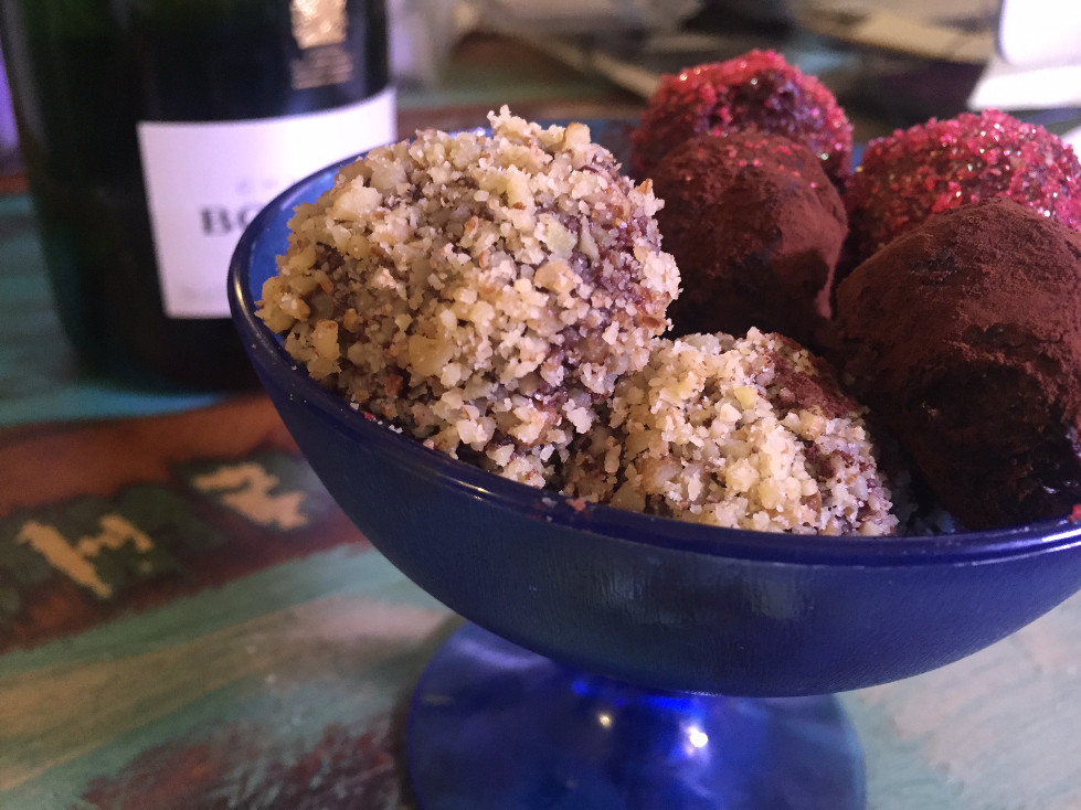 Cointreau chocolate truffles in blue dish by bottle of Bollinger Champagne Easy Chocolate Truffles Recipe Those Someday Goals Valentine's Day dessert ideas