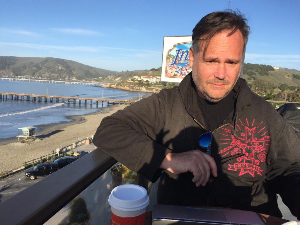 Andy working and sipping tea on the rooftop after breakfast at Joe Mommas Coffee Rooftop Sundeck Cafe Inn at Avila Beach Those Someday Goals