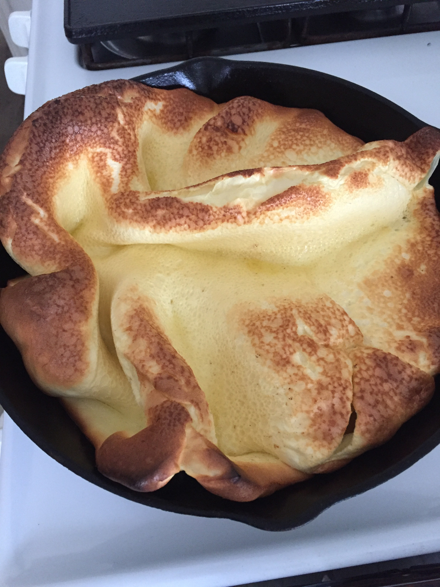 Dutch Baby Pancake recipe German Pancake cast iron skillet on stove Those Someday Goals
