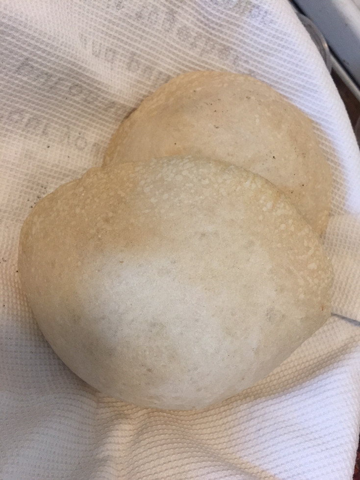 Lightly colored pocketed pitas made in the oven Homemade Pita Bread Recipe Those Someday Goals
