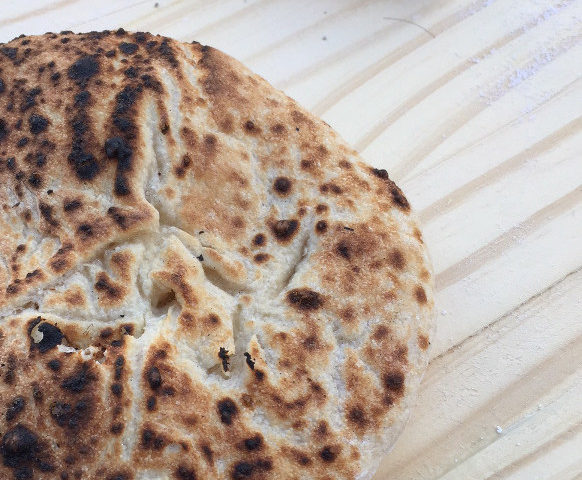 Slightly charred pita made in pizza oven Homemade Pita Bread Recipe Those Someday Goals