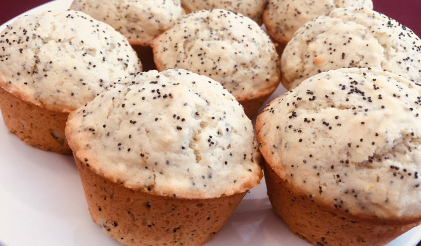 Cooling finished muffins on a white plate Lemon Poppy Seed Muffins baking Those Someday Goals