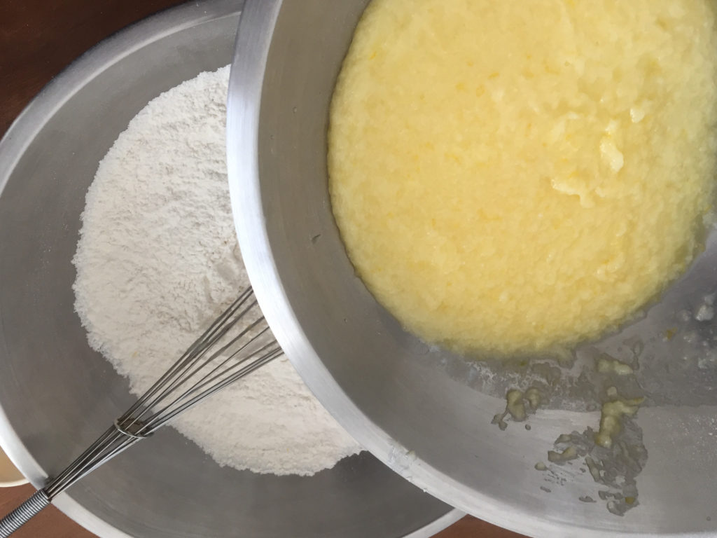Adding wet ingredients to dry Lemon Poppy Seed Muffins baking Those Someday Goals