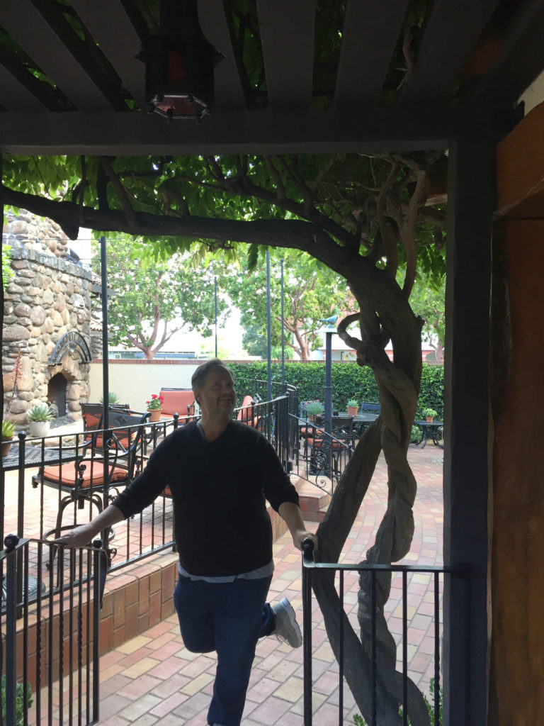 Andy under the vines Rancho Caymus Inn Napa Valley Hotel Rutherford California Those Someday Goals