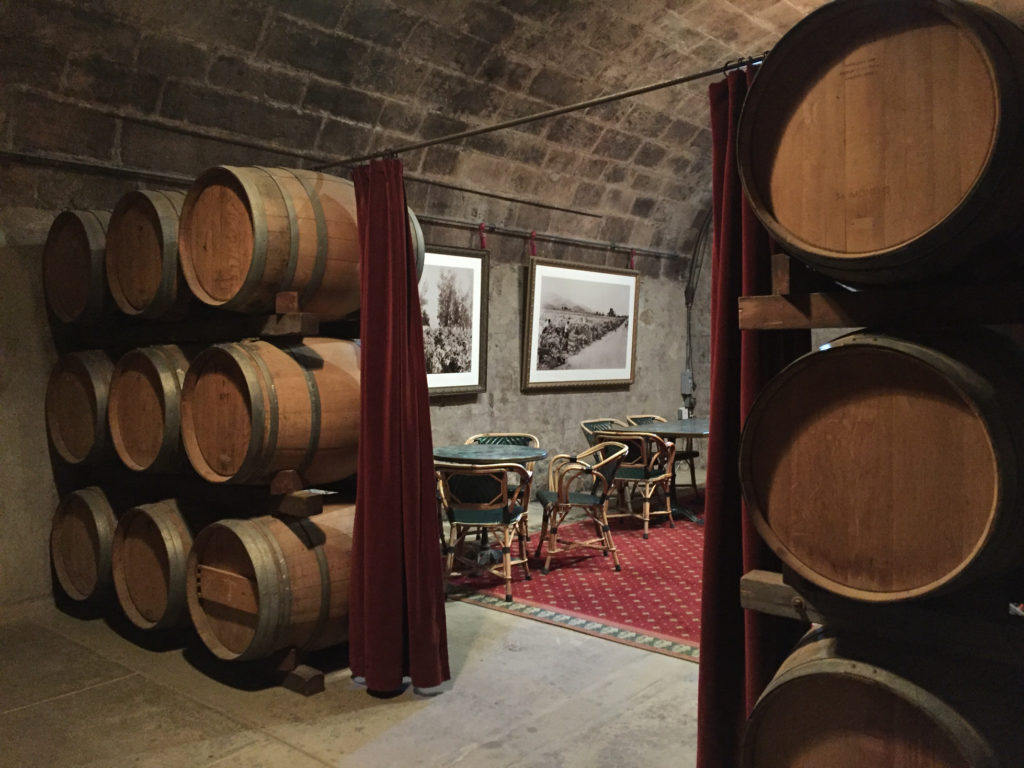Barrels and view of an interior tasting room Inglenook Winery Napa Valley Wineries Those Someday Goals