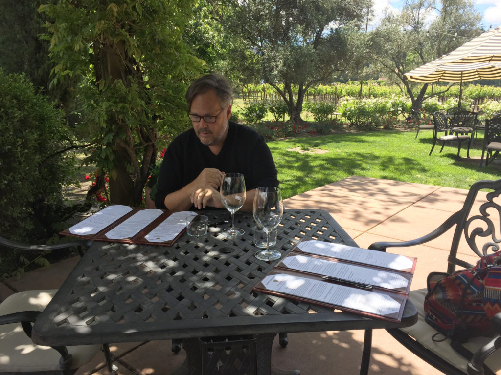 Napa Valley Wine Tasting Bennett Lane Andy reviewing the tasting menus Those Someday Goals