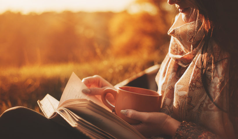Autumn Woman Reading Book Sun Setting Mug in hand Shutterstock LOGVINYUK YULIIA Those Someday Goals