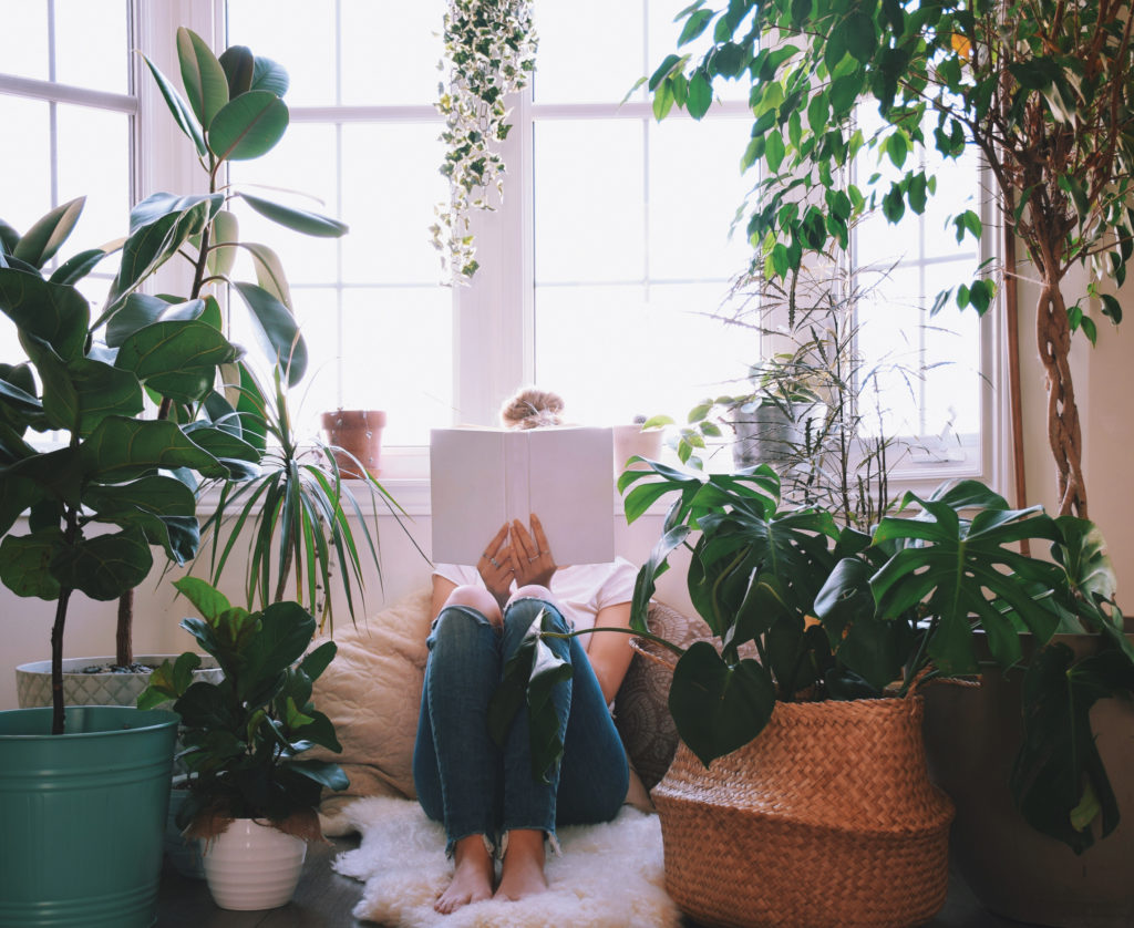 Book Nook on the Floor Girl Reading Book Surrounded by Plants Photo by JulieK2 Those Someday Goals