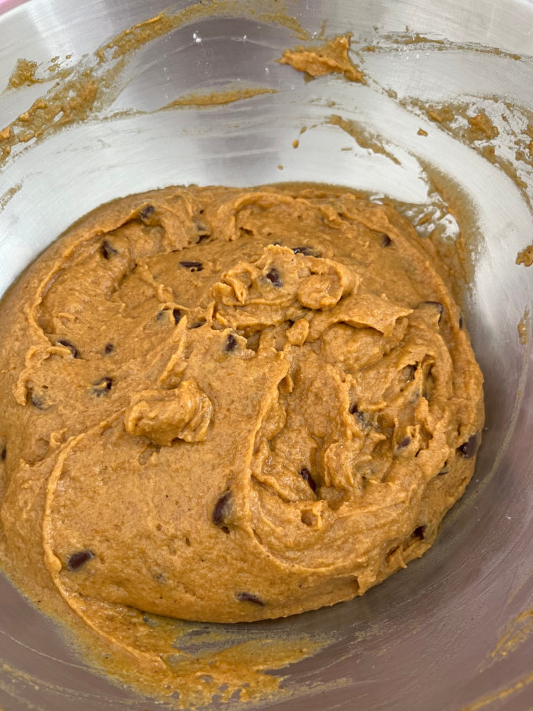 Adding Chocolate Chips to Combined Ingredients Chocolate Chip Pumpkin Bread Recipe Baking Those Someday Goals