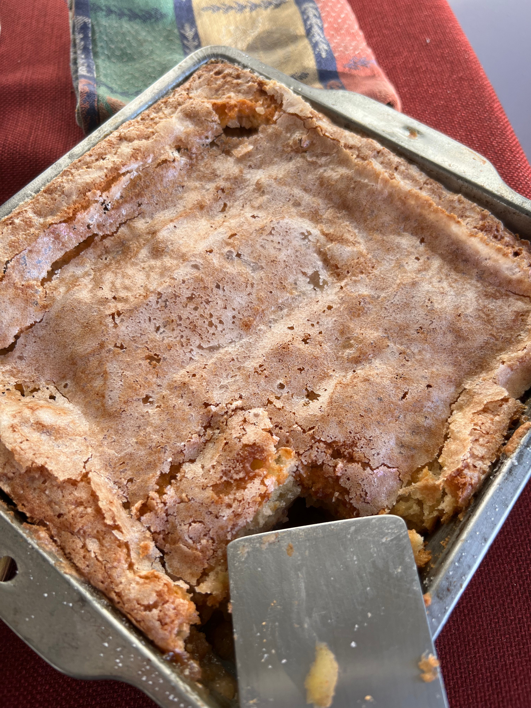 Cooled and sliced apple cobbler in a pan with napkin Holiday Dessert Apple Cobbler Those Someday Goals