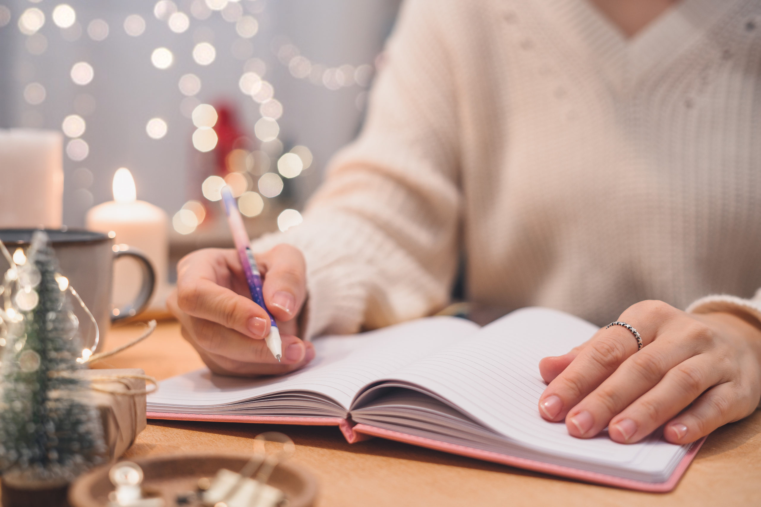 Woman making holiday lists organize and declutter before the holidays Shutterstock Those Someday Goals
