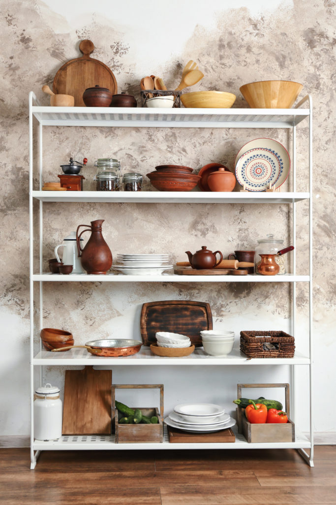 reorganize a pantry freestanding shelves cookware Shutterstock Africa Studio