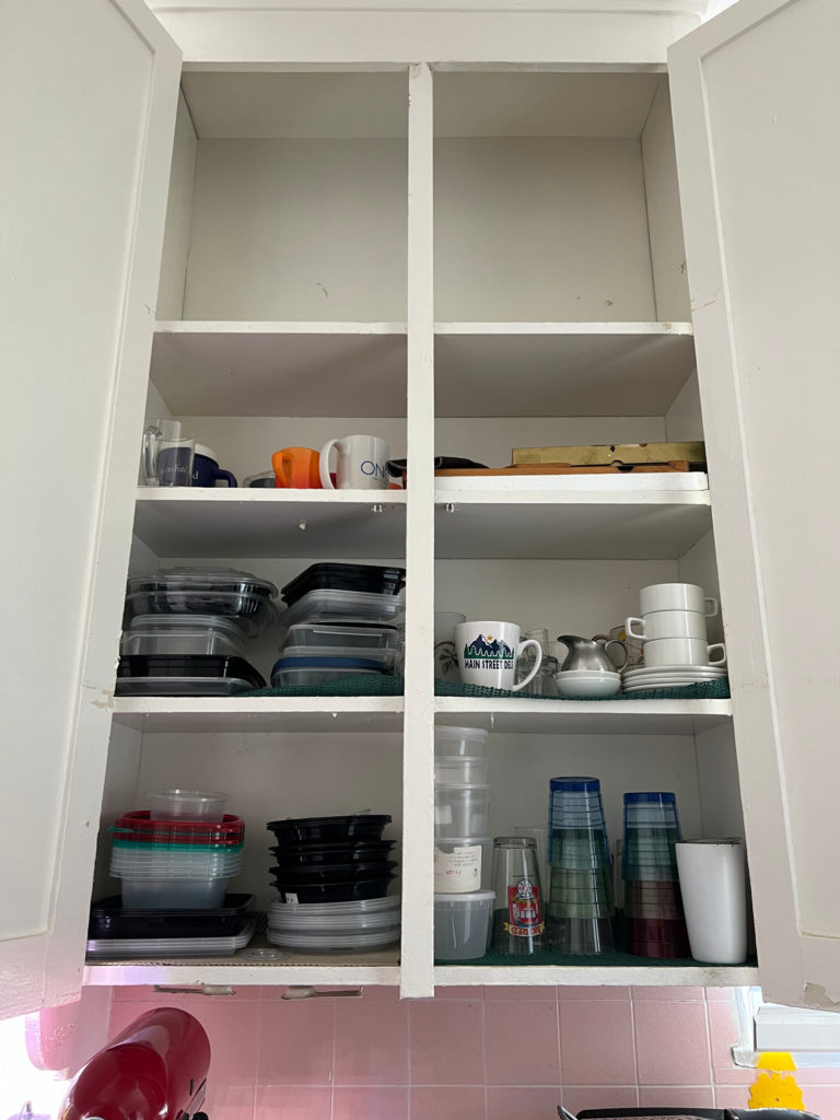 Cabinet Reorganization Storage Solution Under-used kitchen cupboard with cups and tupperware Baking Those Someday Goals