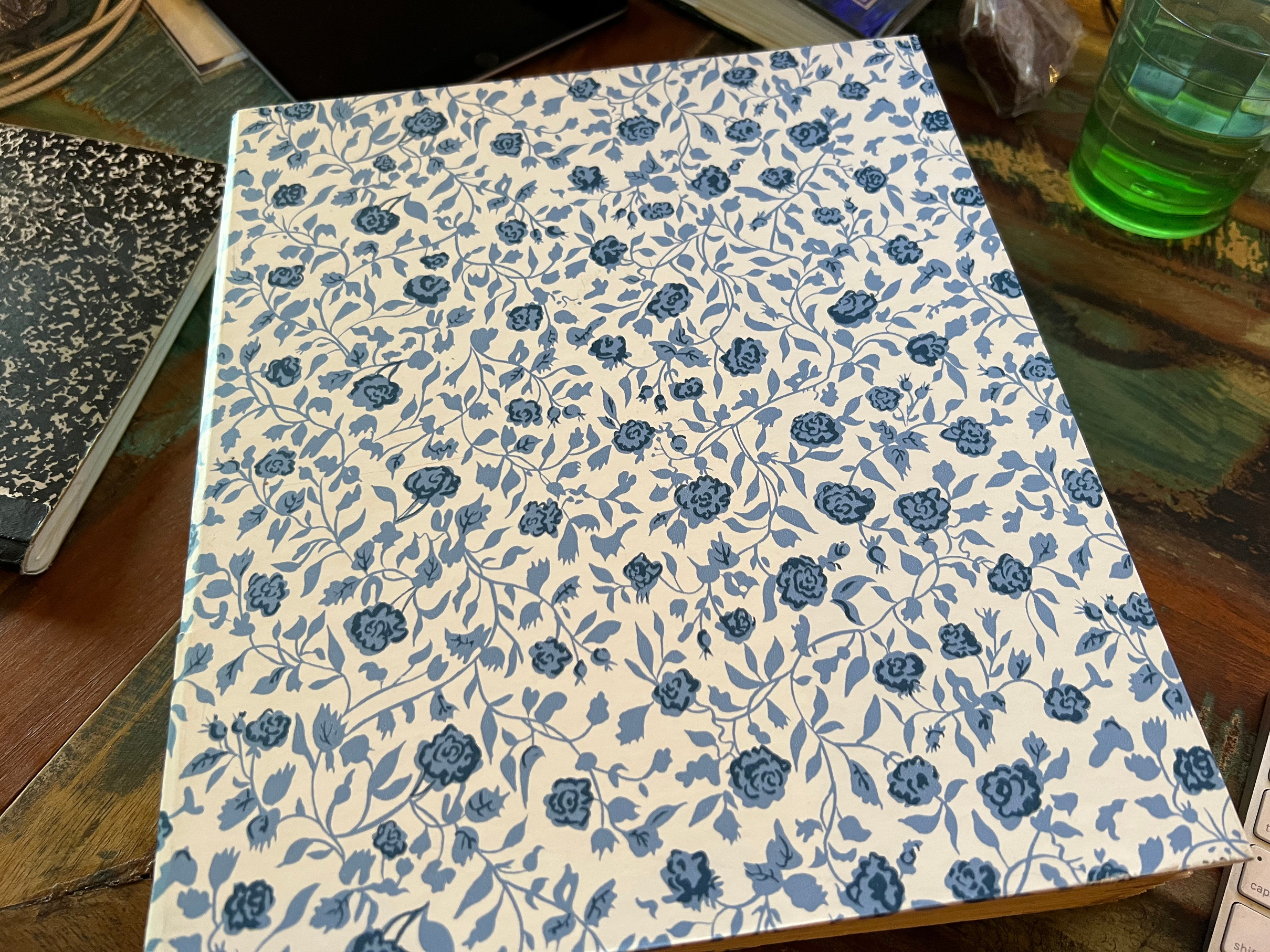 Floral photo album on desk 30-day decluttering challenge minimalism organization Those Someday Goals