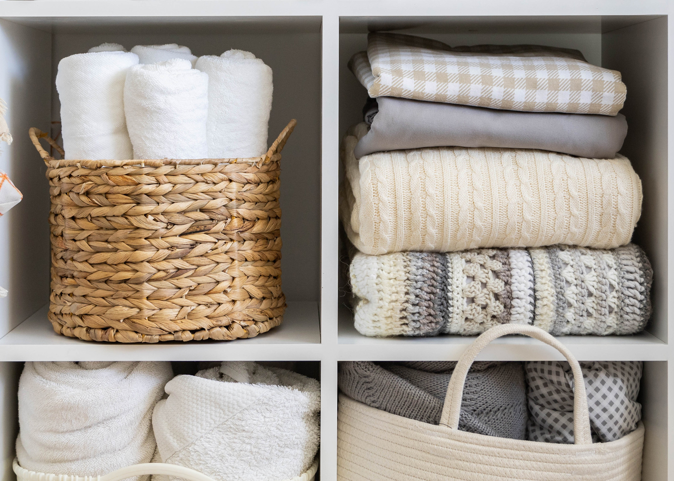 Linen closet bins and items in neutral colors from shutterstock decluttering the linen closet Those Someday Goals