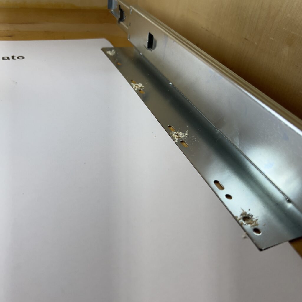 pilot holes drilled along the template for a sliding organizer kitchen cabinet cheap kitchen remodel those someday goals