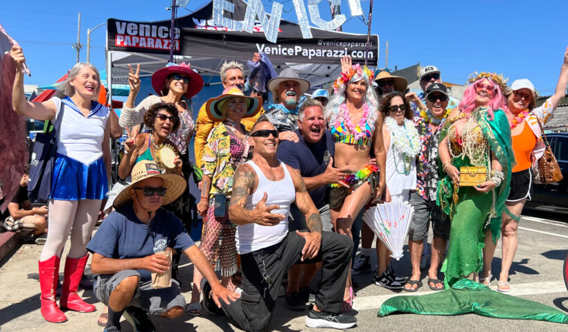 Venice Neptune Festival Parade goers in beach and sea related costumes including mermaids