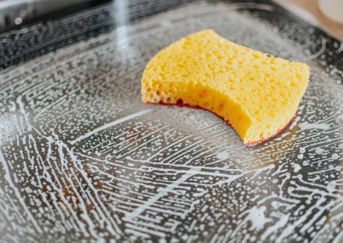 Fall Cleaning with a yellow sponge on metal table Those Someday Goals Photo credit: pille-r-priske-Y1JjwhHaPRM-unsplash